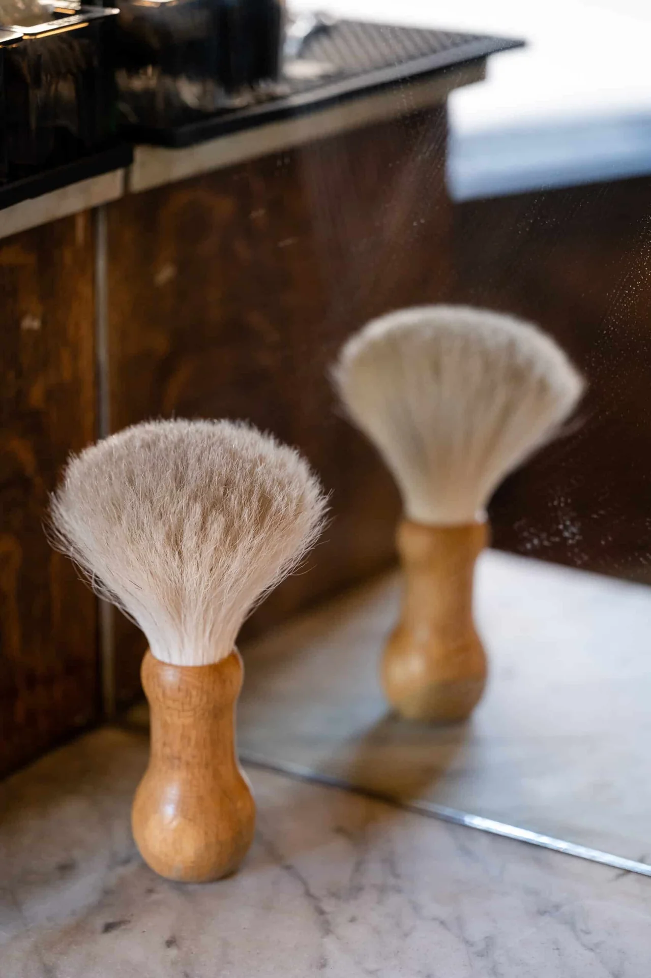A barber at work in the upscale Bookcase and Barber shop, Durango
